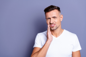 a patient suffering from an uncomfortable chipped tooth