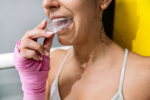 a person wearing an athletic mouthguard